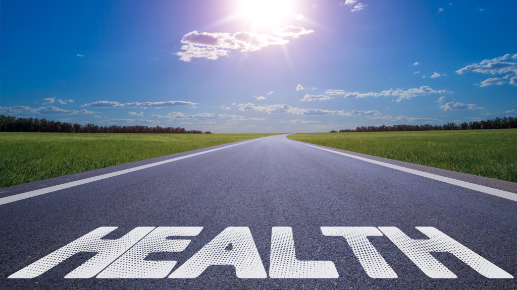 Image of the word health on a long straight roadway, illustrating The Link between oral health and overall health