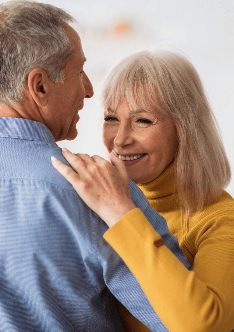 Couple dancing while smiling / Denture services in Norman OK